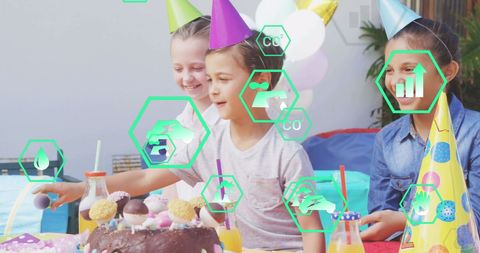 Diverse children celebrating birthday with digital overlay