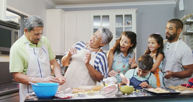 Diverse Family Bonding Through Lively Baking Session in Home Kitchen - Download Free Stock Images Pikwizard.com