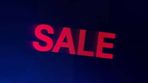 Displaying Red SALE Neon Motion-Blur Sign on Dark Screen for Bold Promotions