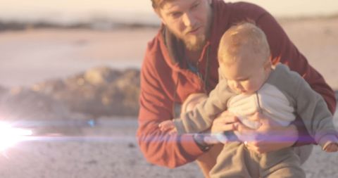 Father Holding Baby Beach Adventure Sunny Evening