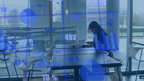 Businesswoman Analyzing Data on Tablet in Modern Office Cafeteria
