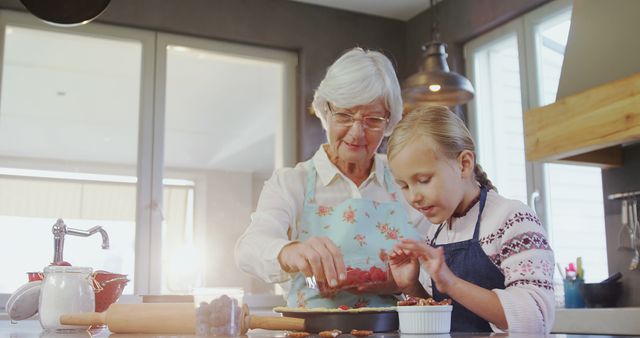 Senior Caucasian Woman Baking with Young Girl in Home Kitchen, Family Bonding Moment - Download Free Stock Images Pikwizard.com