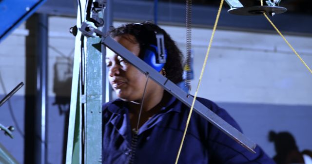 Female Factory Worker Operating Industrial Machinery - Download Free Stock Images Pikwizard.com