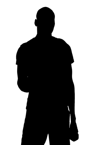 Silhouette of man holding equipment in strong transparent backlight