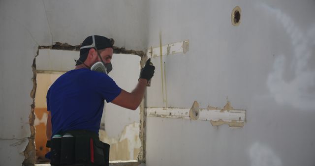 Construction Worker Using Wall Fixture in Renovation Site - Download Free Stock Images Pikwizard.com