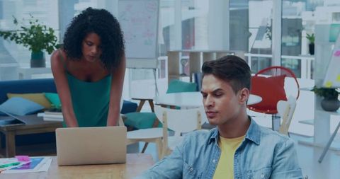 Focused Coworkers Collaborating in Creative Modern Office