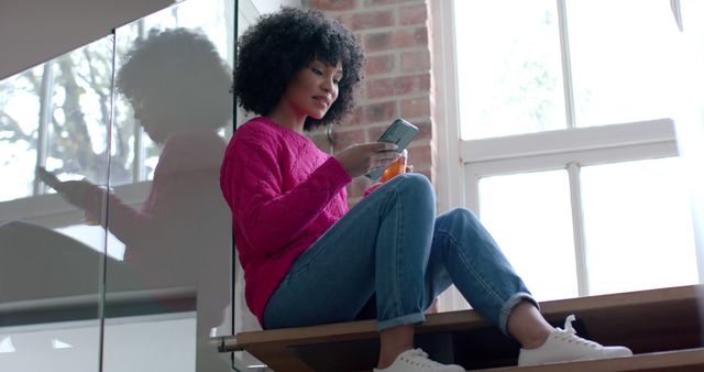 Woman Relaxing on Stairs Using Smartphone at Home - Download Free Stock Images Pikwizard.com