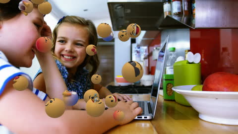 Happy Siblings Using Laptop with Fun Emojis Overlay