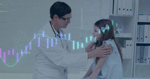 Doctor evaluating young patient in clinic with digital data superimposed