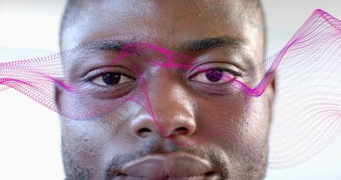 Man gazing forward with digital waveforms illustrating technology