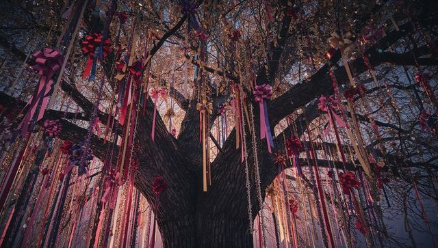 Enchanting Tree Draped with Festive Ribbons at Twilight
