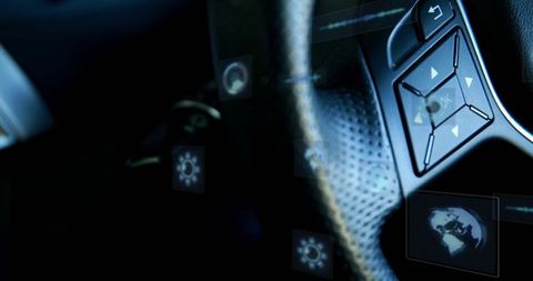 Steering wheel rim with perforated leather, control pad and hud icons in futuristic car