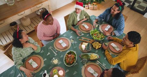 Diverse Friends Celebrating Festive Meal at Holiday Gathering