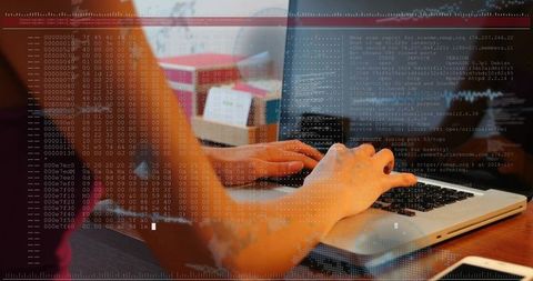 Woman typing code on laptop at home desk with smartphone and hex dump overlay