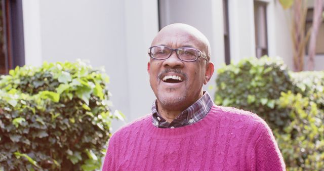 Senior Man Laughing Outdoors in Bright Sweater - Download Free Stock Images Pikwizard.com