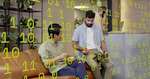 Two colleagues collaborating on tablet in modern coworking lounge with binary overlay