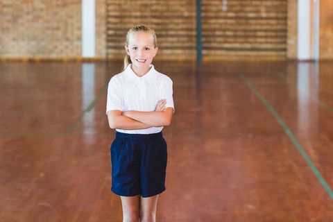 Confident Schoolgirl in Gymnasium Ready for Activity