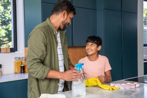 Father and Son Bonding in Kitchen with Cleaning Chores