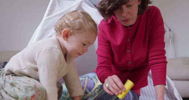 Mother and Daughter Playing with Blocks in Cozy Family Home - Download Free Stock Images Pikwizard.com