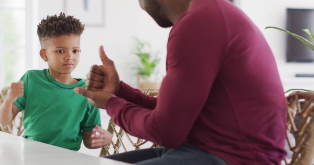 Father Teaching Young Son American Sign Language at Home - Download Free Stock Images Pikwizard.com