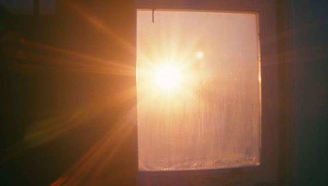 Sunlight streaming through window with lens flares