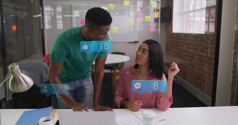 Collaborating colleagues in modern office with social media engagement overlays