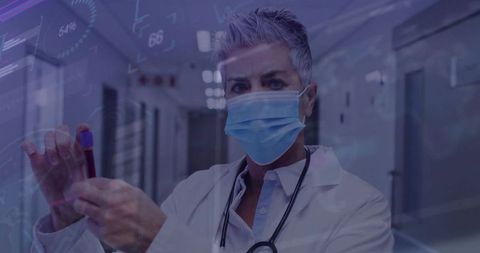 Senior medical professional analyzing blood sample in futuristic hospital