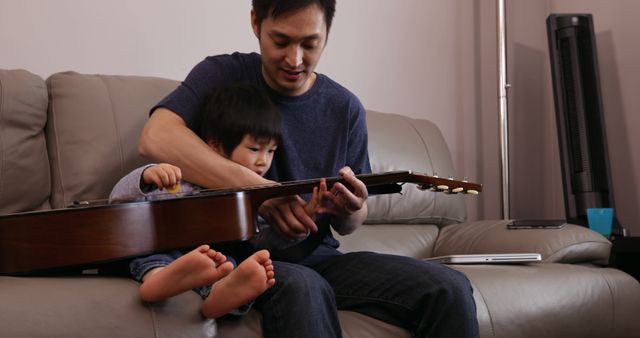 Father Teaching Child Guitar At Home - Download Free Stock Images Pikwizard.com