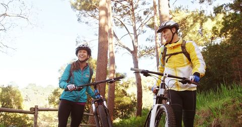 Two Asian Women Enjoying Recreational Cycling in Nature - Download Free Stock Images Pikwizard.com