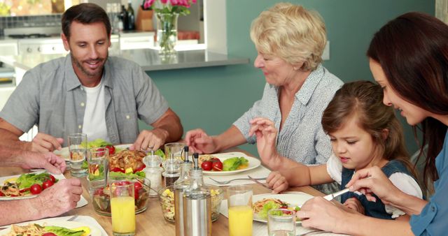 Multigenerational Family Enjoying Meal Together in Dining Room - Download Free Stock Images Pikwizard.com