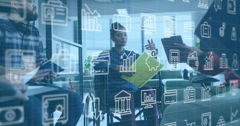 Diverse Team Collaborating in Office Setting with Financial Graphics