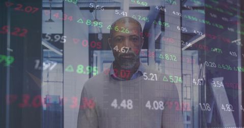 Businessman Analyzing Financial Data on Digital Display in Modern Office