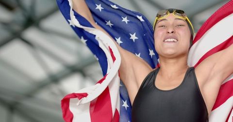 Victorious Female Swimmer Cheering with American Flag