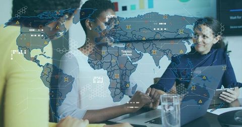 Leading diverse team analyzing global data on laptop with world map and analytics overlay