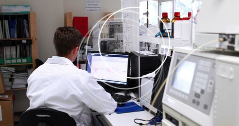 Scientist analyzing data in modern laboratory