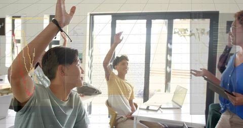 Students Raising Hands in Modern Classroom During Collaborative Discussion and Active Learning