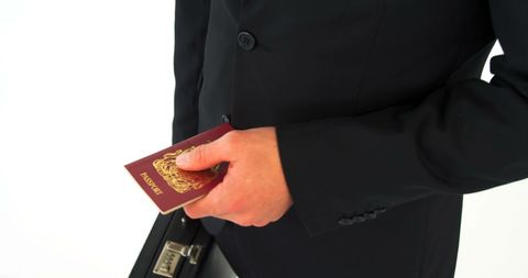 Businessman Holding Passport with Briefcase - Download Free Stock Images Pikwizard.com