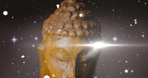 Buddha head wooden sculpture glowing against cosmic backdrop