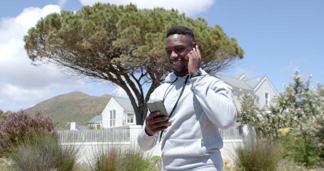 African American Man Enjoying Phone Call Outdoors in Nature - Download Free Stock Images Pikwizard.com