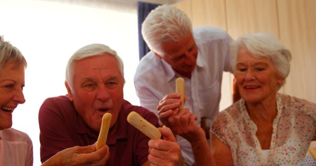 Group of Seniors Enjoying Snacks Together at Home - Download Free Stock Images Pikwizard.com