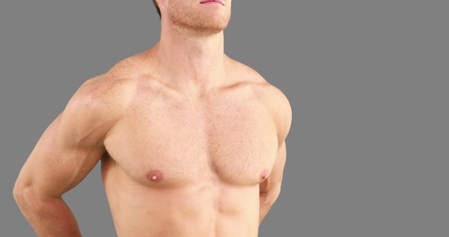 A shirtless Caucasian man stands confidently, showcasing his fit physique, with copy space - Download Free Stock Photos Pikwizard.com