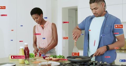 Couple cooking and slicing vegetables in modern kitchen with social media overlays