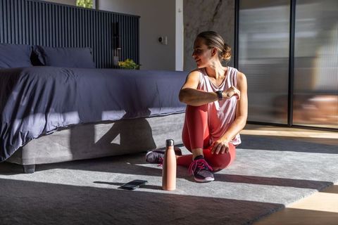 Sunlit morning home workout and recovery routine in minimalist contemporary bedroom