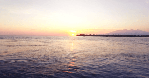 transparent sunset over tranquil ocean - Download Free Stock Videos Pikwizard.com
