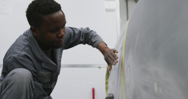 Focused Auto Body Repair Technician Working on Car Surface - Download Free Stock Images Pikwizard.com