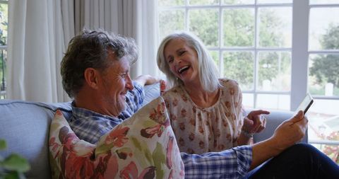 Happy Senior Couple Relaxing Together with Tablet - Download Free Stock Images Pikwizard.com