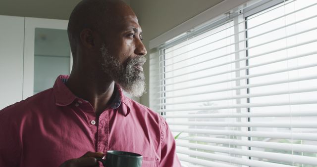 Thoughtful Older Man Drinking Coffee Looking Out Window - Download Free Stock Images Pikwizard.com