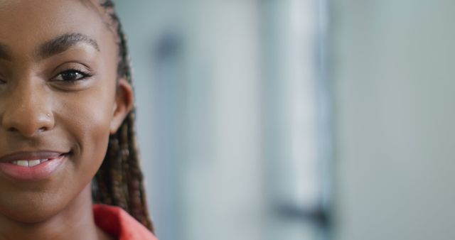 Confident Young Woman with Braided Hair Smiling - Download Free Stock Images Pikwizard.com