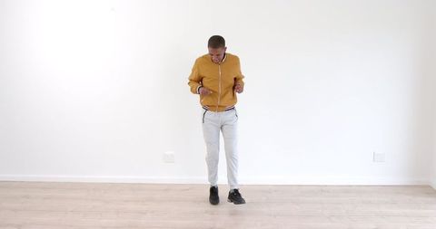 Energetic Dance by Young Man in Stylish Yellow Jacket