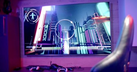 High-tech gaming setup with large screen tv and accessories